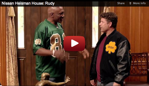 Photo of Tim Brown and “Rudy” at home in the Nissan Heisman House