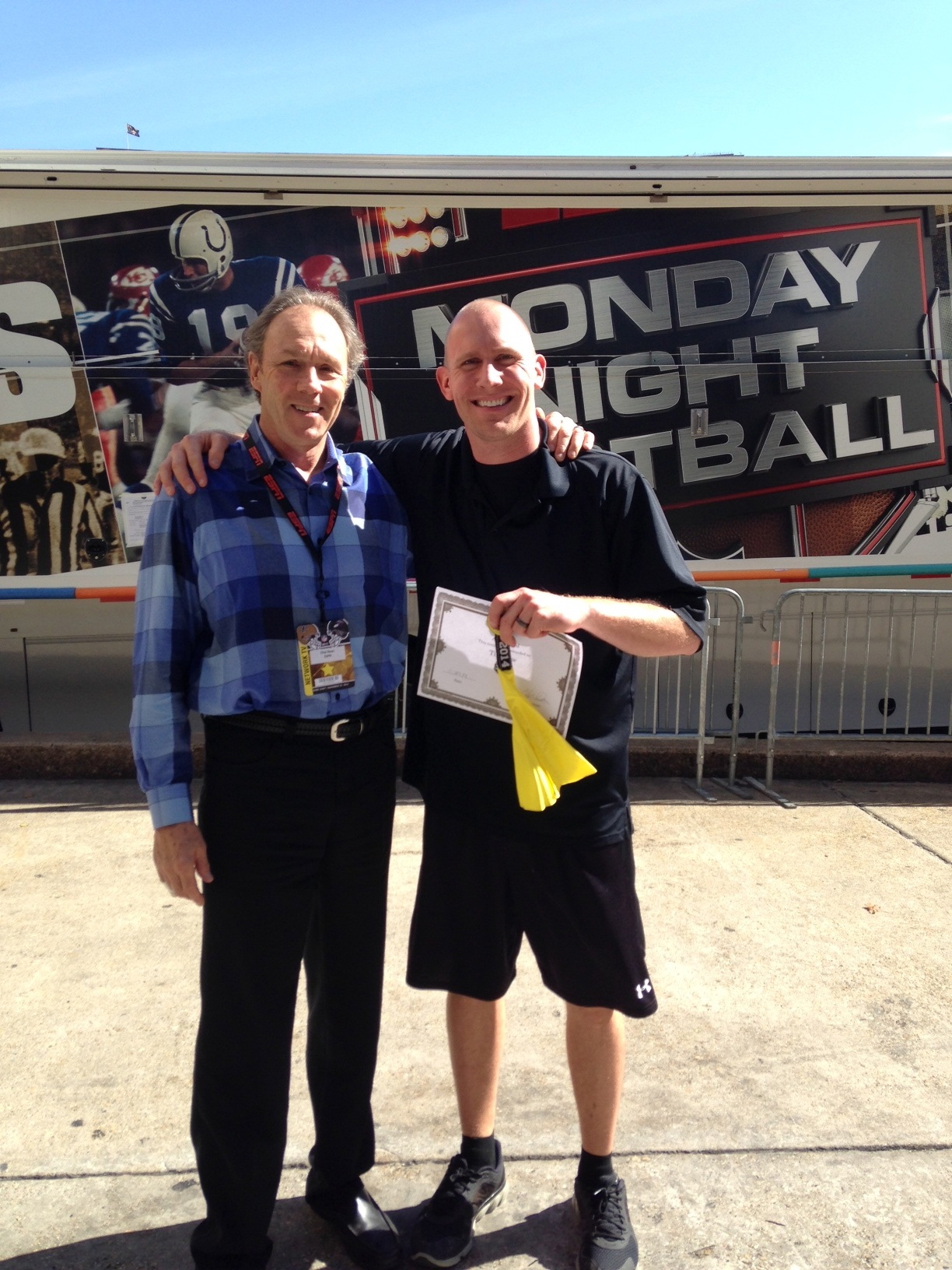 Camera operator Jackson Helms Smith, standing to the right of Chip Dean , holds an Atta Award. (Jodi Brits/ESPN)