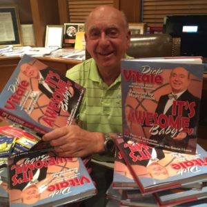 Dick Vitale with his book "It's Awesome, Baby!: 75 Years of Memories and a Lifetime of Opinions on the Game I Love" (Dick Vitale)