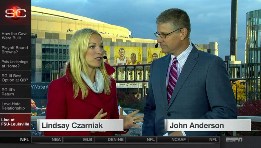 SportsCenter anchors Lindsay Czarniak and John Anderson in Cleveland  prior to LeBron James’ return in the Cavs’ home opener against the Knicks. (ESPN)