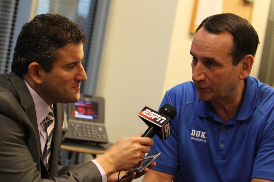 ESPN.com senior writer Andy Katz (l) interviews Mike Krzyzewski during the 2014 ACC Men's College Basketball Media Day. (Travis Bell/ESPN Images)