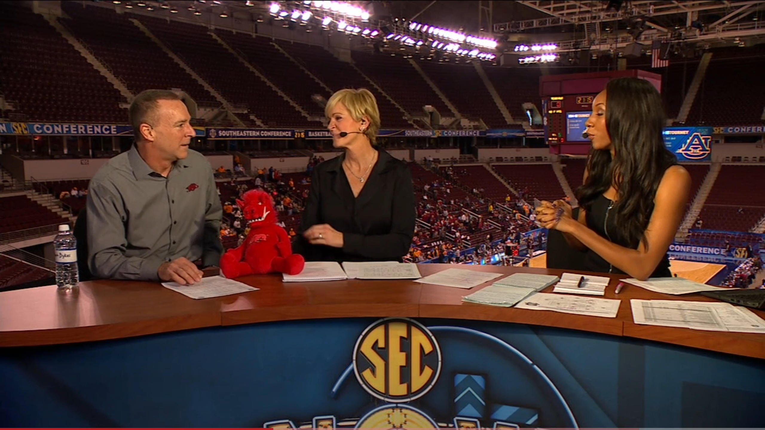 (L-R) Jimmy Dykes, former longtime ESPN college basketball analyst who now coaches the Arkansas women's team, joined analyst Nell Fortner and host Maria Taylor on the set of SEC Now after a Razorbacks' game in early March.