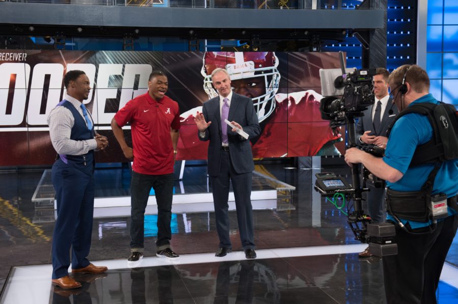 ESPN NFL analyst Brian Dawkins (l) and host Trey Wingo flank Alabama wide receiver Amari Cooper on the set of NFL Live earlier this month.  (Rich Arden / ESPN Images)