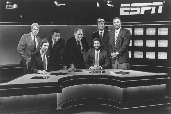 ESPN’s 1990 Baseball Tonight production team and commentators on the set. Seated (L-R): Eric Schoenfeld, coordinating producer, and Barry Sacks, producer. Standing (L-R): commentators Peter Gammons, John Saunders, Dave Marash, Ray Knight and Bill Robinson. (John Garaventa)