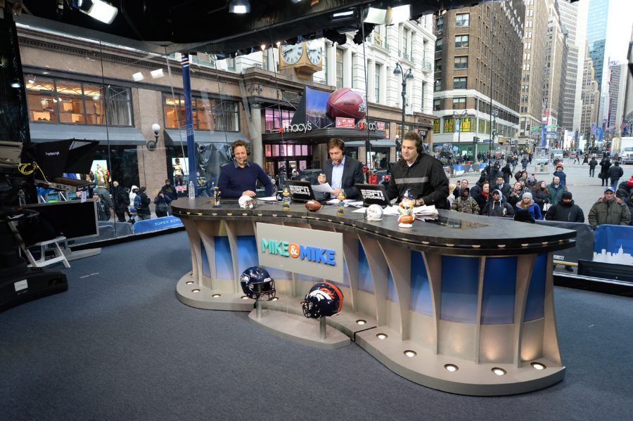 Comedian Seth Meyers (L) on the set of Mike & Mike with co-hosts Mike Greenberg and Mike Golic during Super Bowl week 2014 in New York City. (Joe Faraoni/ESPN Images)