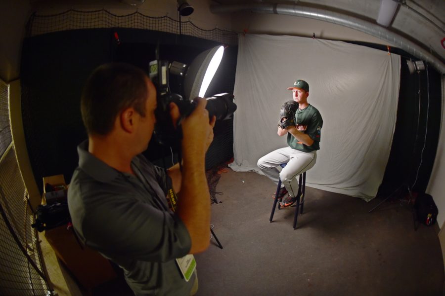 ESPN photographer Phil Ellsworth taking portrait photos of University of Miami pitcher Sam Abrams on Friday, June 12, at TD Ameritrade Park. (Photo courtesy Phil Ellsworth)