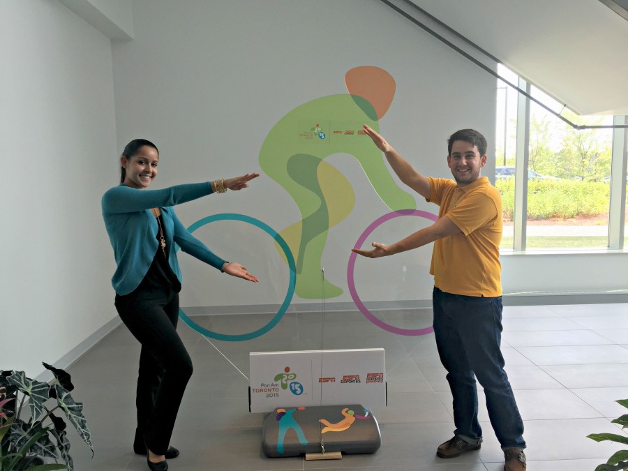 Eneisy Rodriguez and Miguel Machado doing the Florida Gator "chomp" in front of a Pan Am Games sign on ESPN’s Bristol, Conn. campus. (Kyle Van Fechtmann/ESPN)