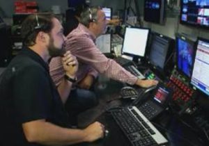 Director Matt Sellars and producer Tony Honkus monitoring Everett from the control room.