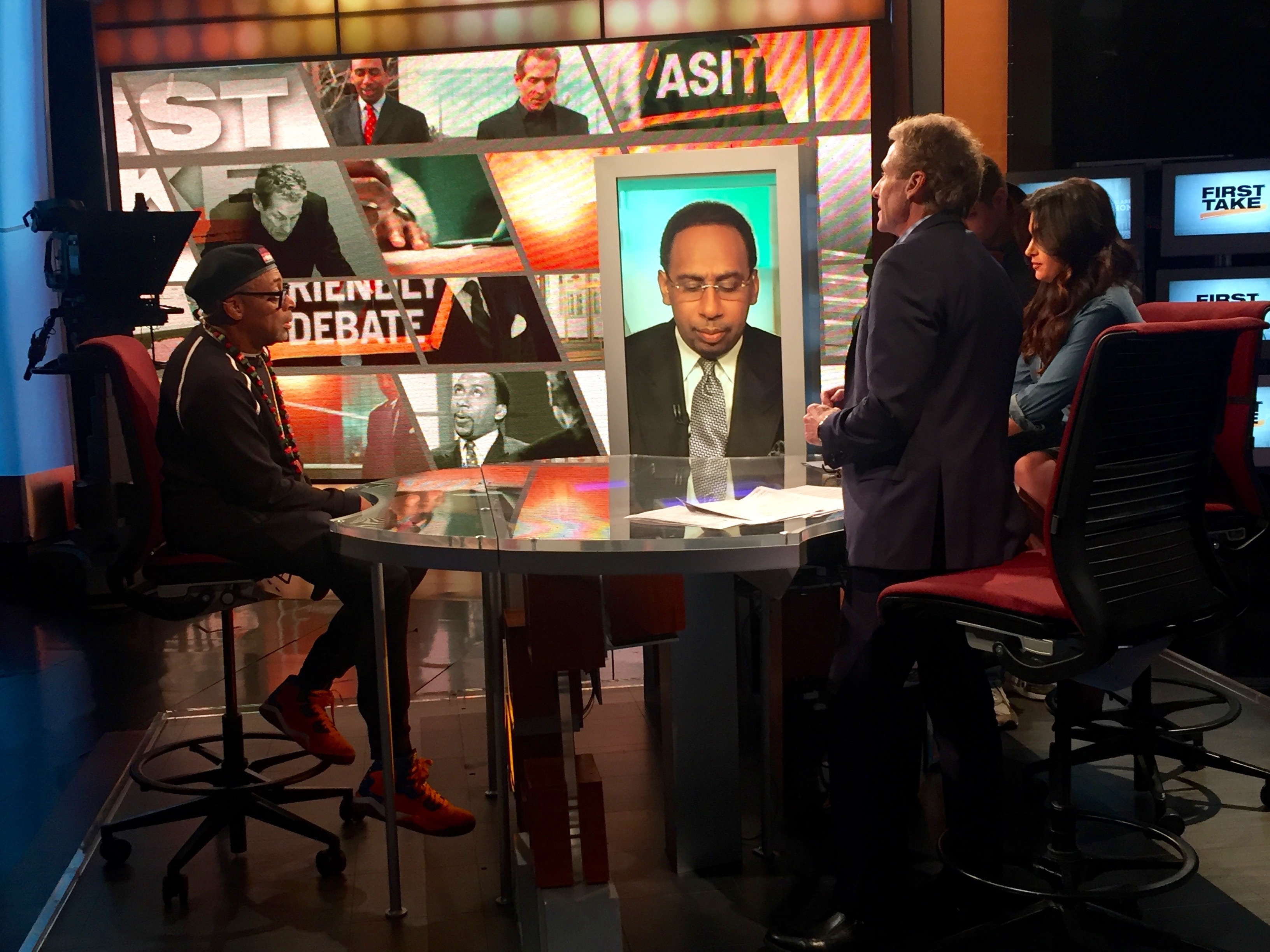 Spike Lee during a First Take commercial break with moderator Molly Qerim and featured commentators Stephen A. Smith and Skip Bayless. (Kate Rosen/ESPN)