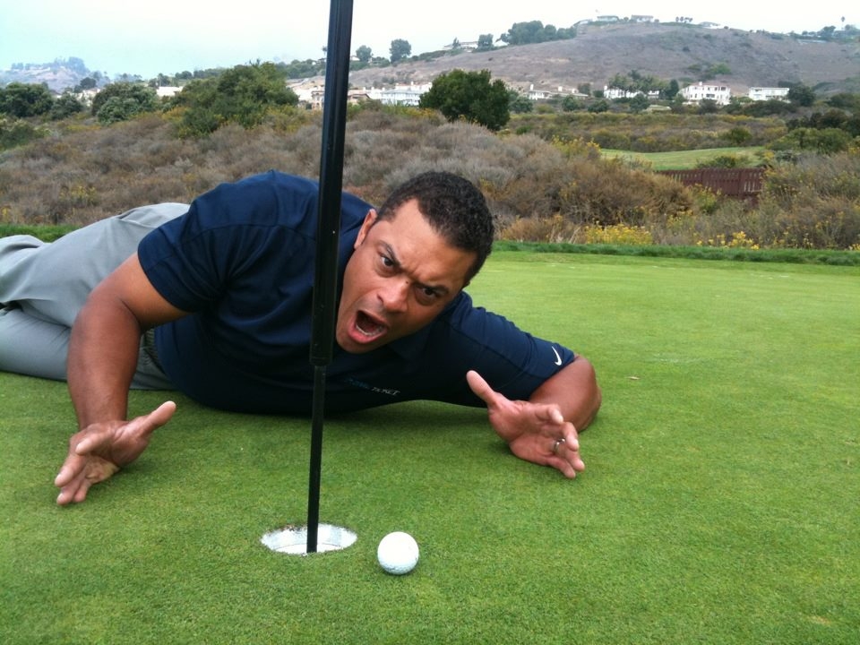 Michael Eaves posing with his near hole-in-one at his home course in LA.  (Photo courtesy Michael Eaves)	