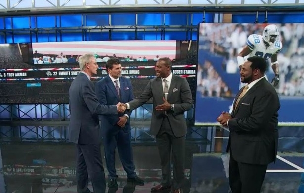ESPN NFL analyst Darren Woodson (second from right), accepts congratulations from NFL Live host Trey Wingo (left), and NFL analysts Mark Schlereth (second from left) and Jerome Bettis (far right).