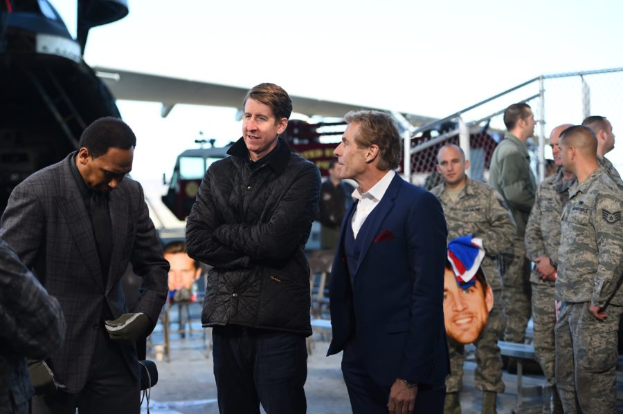 On Nov. 9 at Westover Air Reserve Base in Chicopee, Mass.,  the First Take team of Stephen A. Smith, Whit Albohm and Skip Bayless huddle while preparing for the show's ESPN Veterans Week special.  (Joe Faraoni/ESPN Images)