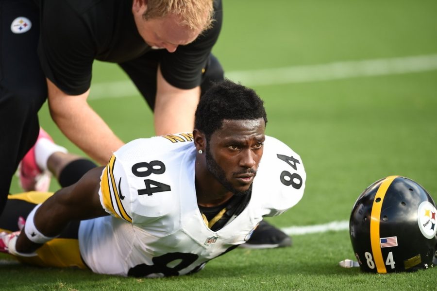 Brown  works on his flexibility prior a Monday Night Football game in San Diego this season. (Scott Clarke/ESPN Images)