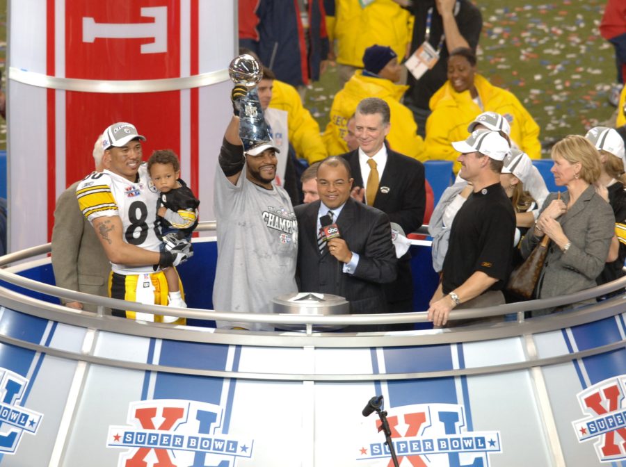 On Feb. 5, 2006, the Pittsburgh Steelers defeated the Seattle Seahawks, 21-10, to win Super Bowl XL at Ford Field in Detroit. The game aired on ABC. Pictured during the postgame trophy presentation (L-R): Game MVP WR Hines Ward; Steelers RB and current ESPN analyst Jerome Bettis; ESPN commentator Mike Tirico and Steelers head coach Bill Cowher. (Ida Mae Astute/ABC)