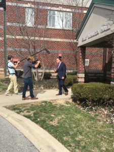 John Barr films a stand-up outside Billy Minardi Hall at the University of Louisville. (Caitlin Stanco/ESPN)
