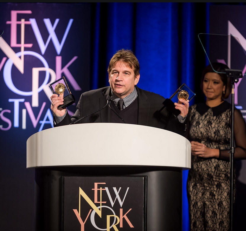 Mike Szykowny, senior director, motion graphics accepts two NY Festival Awards Gold Medals for Monday Night Football, for best animation and best show open. (Courtesy New York Festivals)