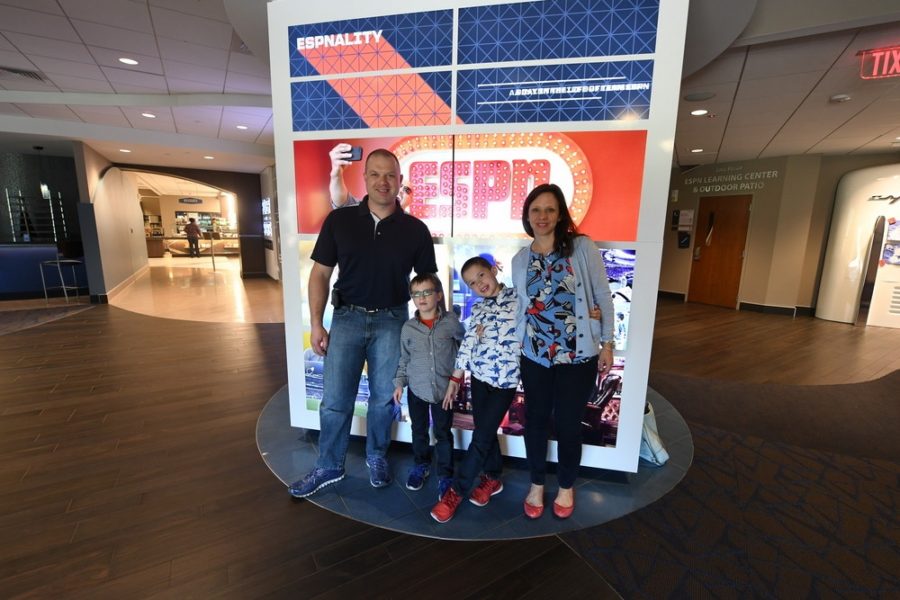 Rich Marchese (left), a resident of nearby Southington, Conn., is the random-drawing winner of the ESPN 2016 Men's Tournament Challenge. He visited the company's Bristol, Conn., headquarters with his family.  (Joe Faraoni/ESPN Images)