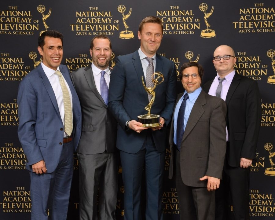 The E:60 team celebrates with one of its two Sports Emmys won Tuesday night. (Marc Bryan-Brown Photography)