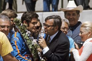 In 1971, ABC Sports commentator Chris Economaki (right) interviews Indy 500 winner Al Unser. (ABC Photo Archives)