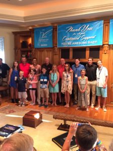 Dick Vitale (center, red shirt) and Robin Roberts (third from left, back row) pose with his "all-courageous team" of  children as well as Ohio State football coach Urban Meyer (far left, red shirt) and former Wisconsin basketball coach Bo Ryan (back row left, black shirt). (Mike Soltys/ESPN) 