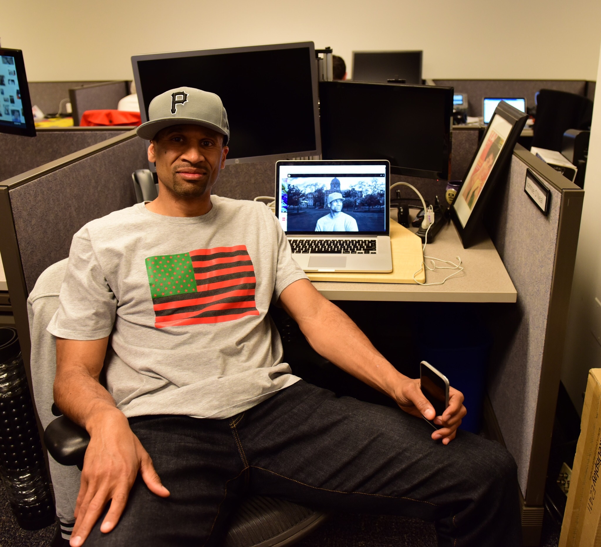 Jesse Washington in the office of The Undefeated with "The Waco Horror" open on laptop behind him. (Kea Taylor/ESPN Images)
