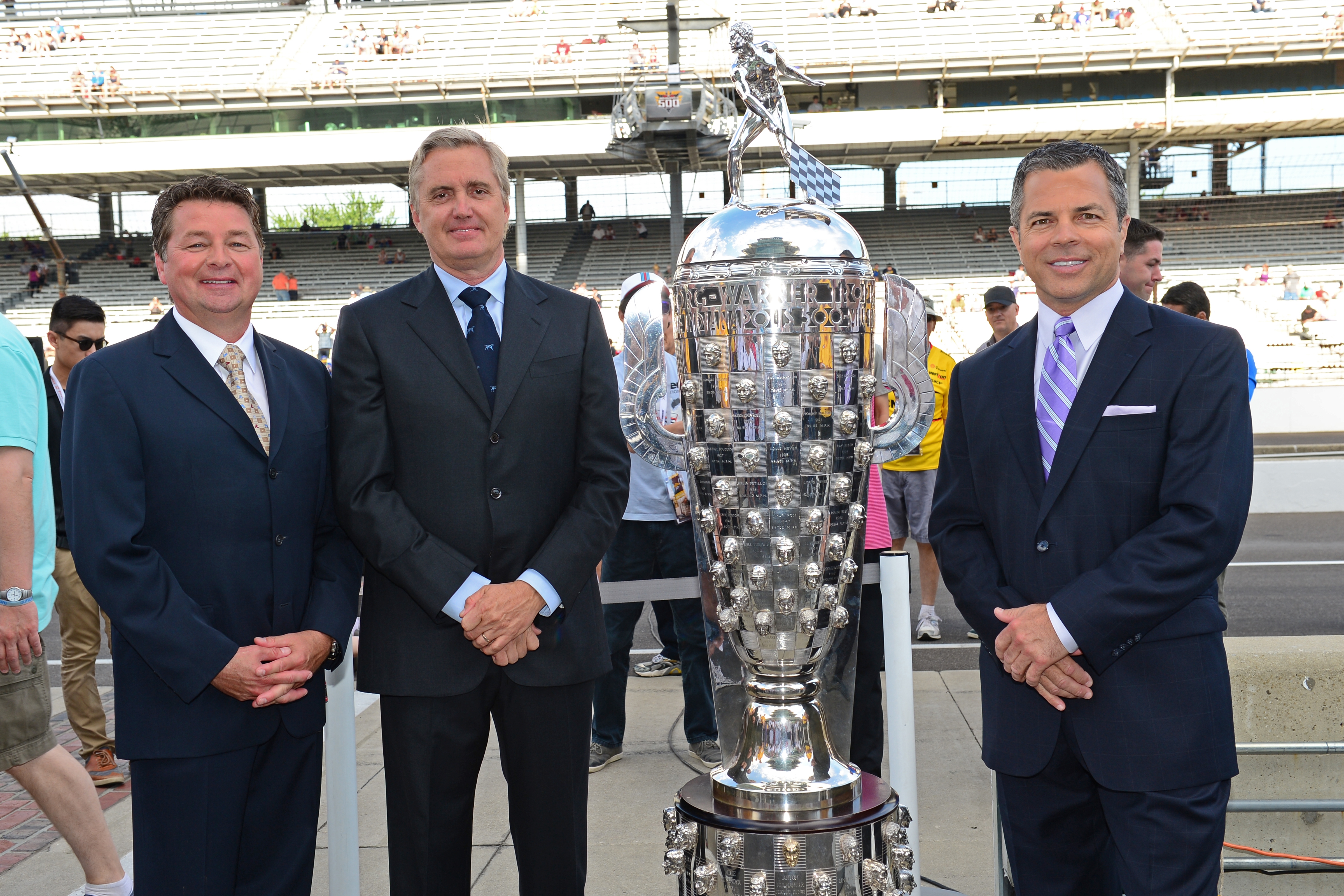 (L-R) Scott Goodyear, Eddie Cheever and Allen Bestwick with the in the Borg-Warner Trophy at the 98th Indianapolis 500 (Phil Ellsworth/ESPN Images)