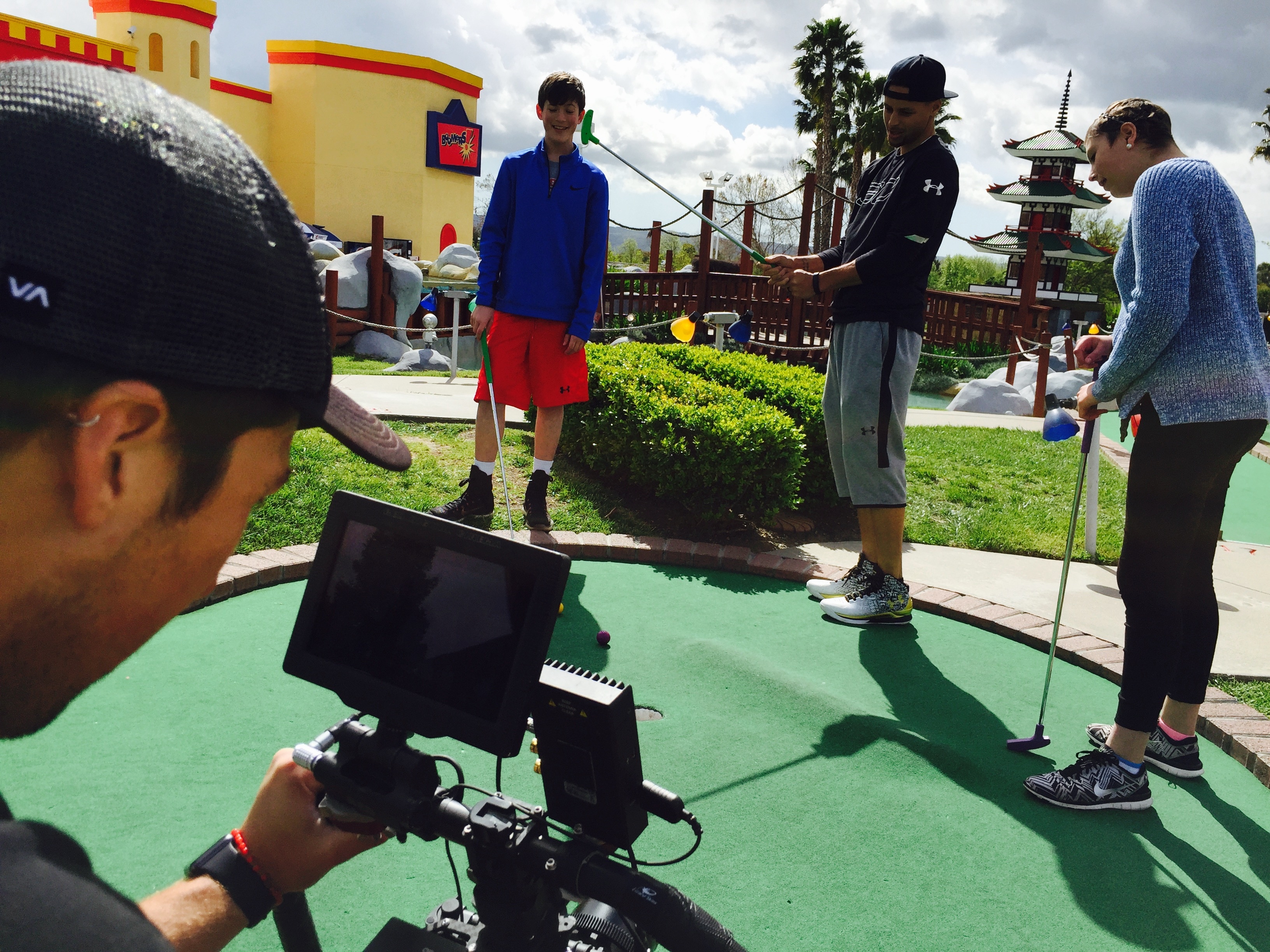 Steph Curry plays miniature golf with ESPN “My Wish” recipient Ashley and her brother Grant. (Michael O’Connor/ESPN)