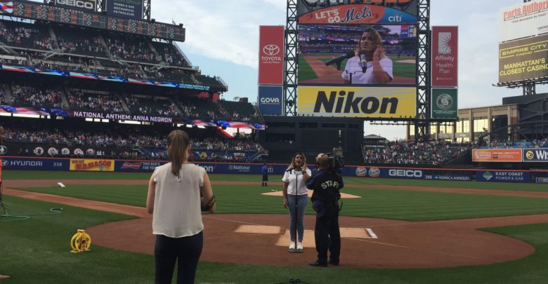Photo of ESPN Communications publicist sings national anthem at Mets game