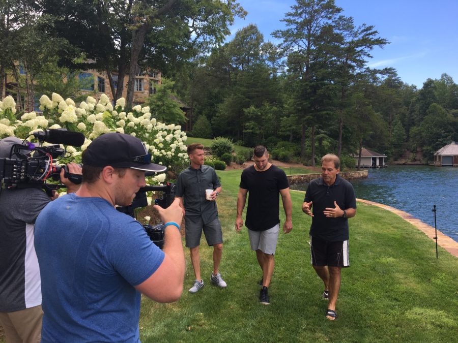 Alabama coach Nick Saban (right) walks and talks with ESPN’s Marty Smith and Tim Tebow at Saban’s lake home in Georgia. (Jonathan Whyley/ESPN)