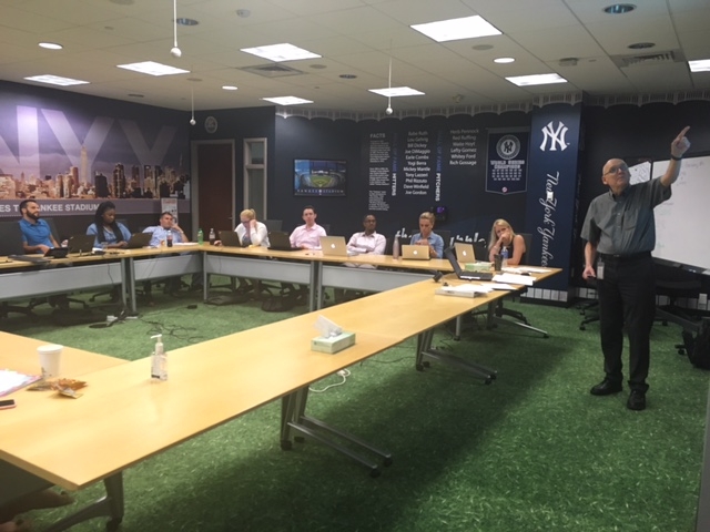 Sawastky (far right) teaches his class in the Yankees theme conference room at ESPN. (Molly Mita/ESPN)