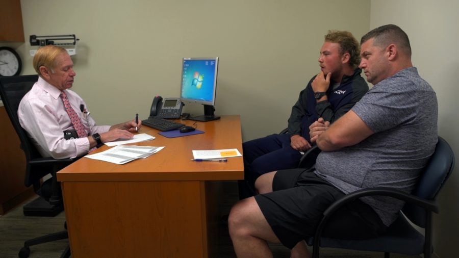Casey and Jack Cochran consult with a doctor about Casey's concussions.