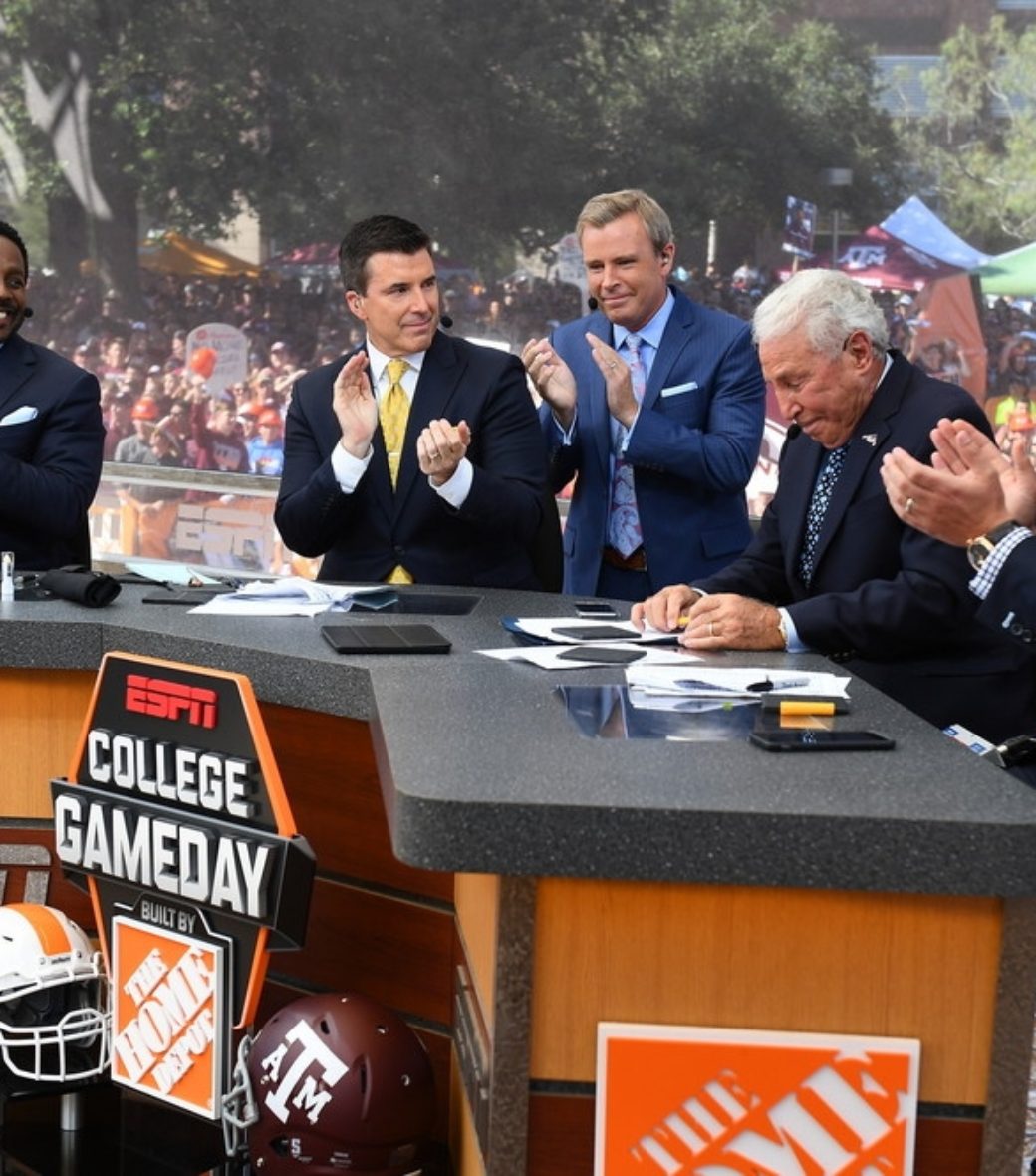 Celebrating “wonderful person” Lee Corso’s (second from right) 20 years of <em>CGD</em> head gear selections “was a highlight,” Gaiero said. (Joe Faraoni/ESPN Images)