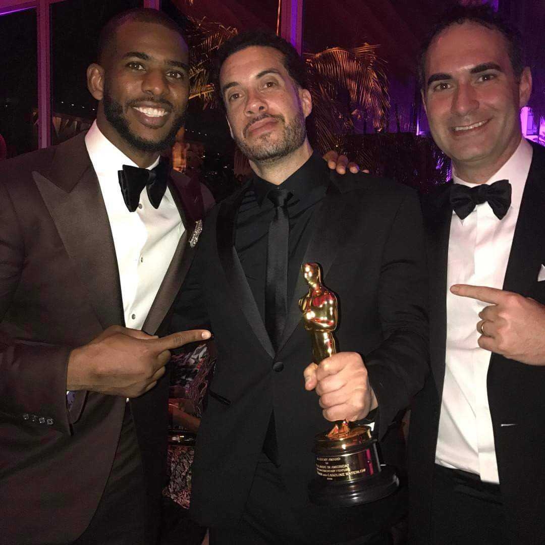 Chris Paul, Ezra Edelman and Connor Schell celebrate the win at the Vanity Fair Oscar party. (Photo courtesy of ESPN Films)