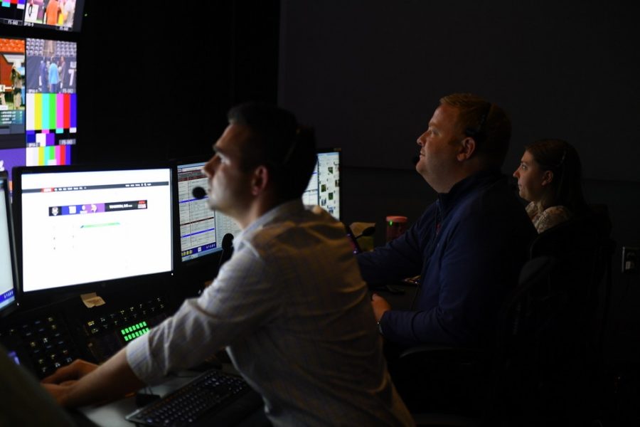 Sunday NFL Countdown’s duo of producers Matthew Garrett (middle) and Chad Minutillo (left) run the program from the control room. (Joe Faraoni/ESPN Images)