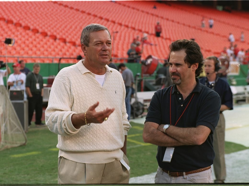 2000: Executive producer, Don Ohlmeyer, of ABC’s NFL “Monday Night Football” talks to sideline Dennis Miller before the game between the Seattle Seahawks and the Kansas City Chiefs. (ABC/CRAIG SJODIN)